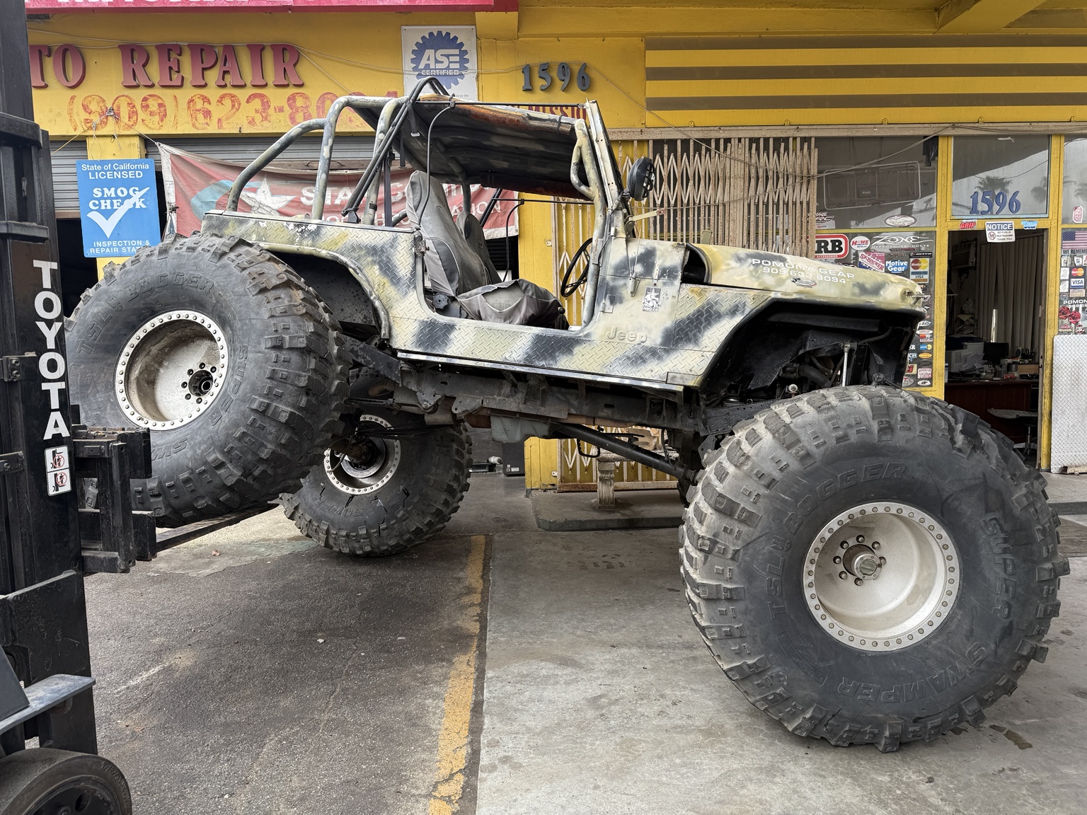 Pomona Gear custom Jeep in front of the shop